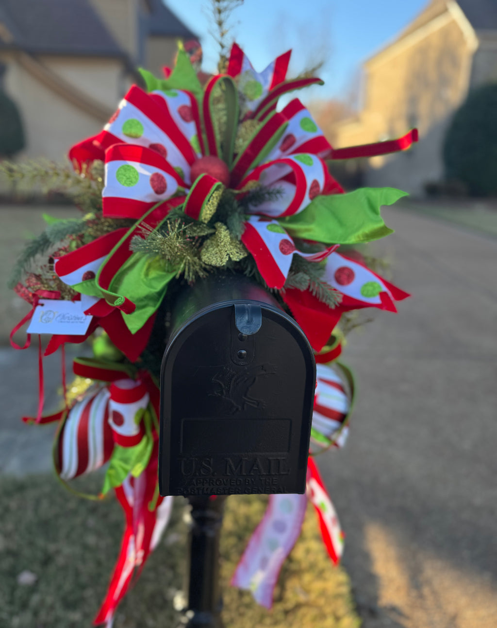 Polka Dots Mailbox Swag .  Christmas mailbox decoration.  Colors: Red, lime green and White.  Measures: 36"H x 22"L x 27" W.   Outdoor use .  Fits standard mailbox like the one pictured.