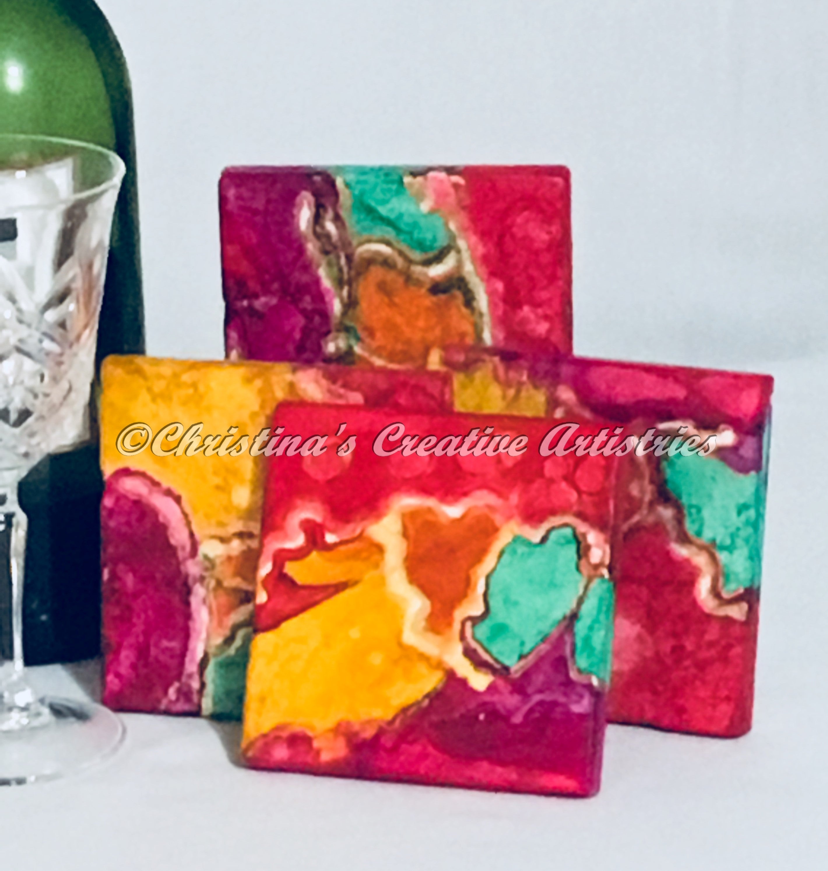 Features 4x4 stone tile, hand painted in teal, magenta, yellow, orange and red. All coasters are sealed and cork backed.  Iron coaster stand included.