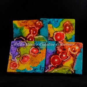 Jubilee Stone Coaster product image.  Features 4x4 hand painted contemporary design on Botticino marble tile.  Colors are teal, purple, yellow, red and orange.  Sold as a set of 4.  Coasters are cork backed.  Coaster stand included. 