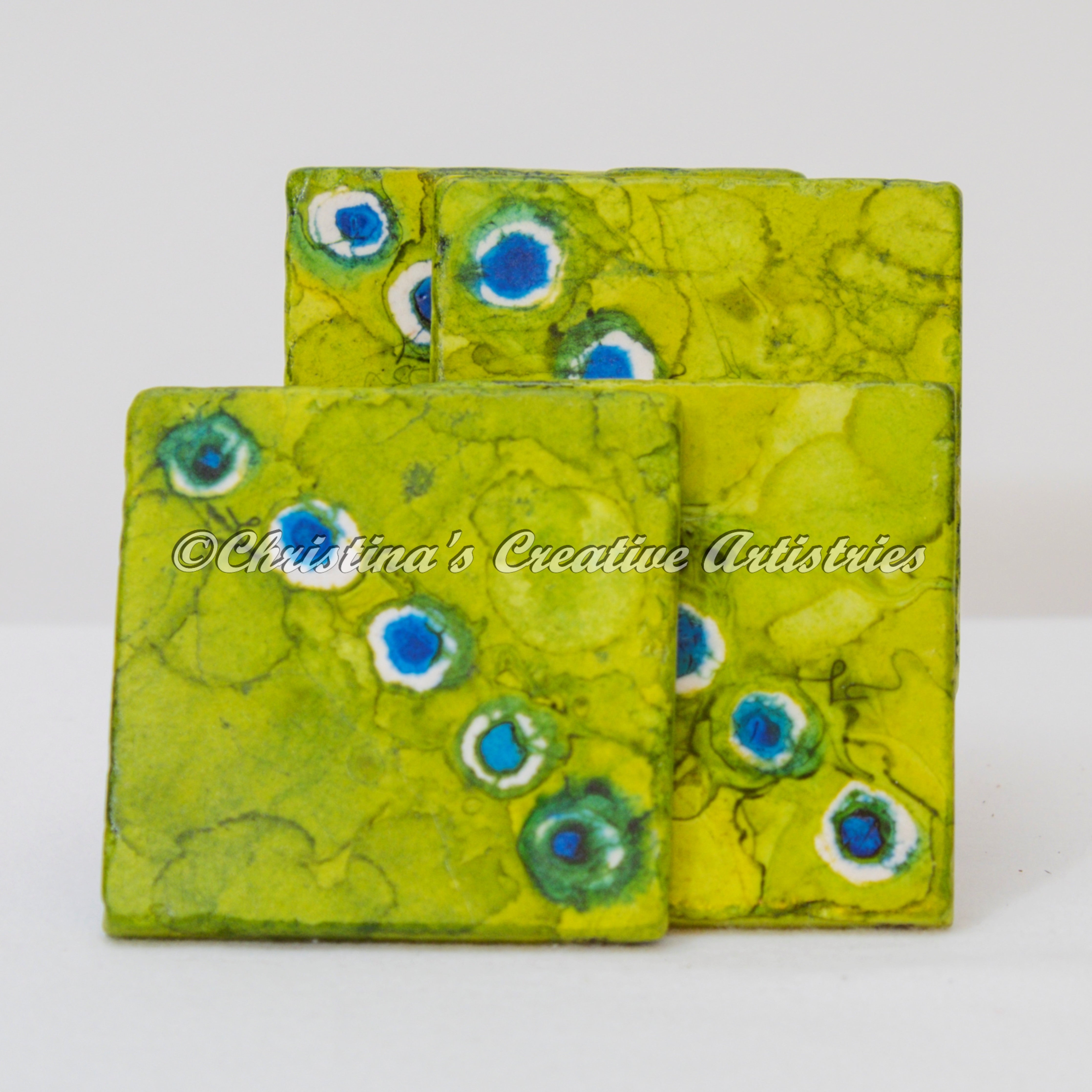 Peacock Stroll features a set of 4 coasters.  Hand painted beautiful coasters in lime green  with blue dots.  Water absorbent.  Cork backed.  Iron coaster stand included.