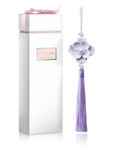 Youth Collection Secret Wonderland-Midnight Crystal features one unglazed porcelain flower ornament diffuser with attached tassel and rope hanger.  One 5ml bottle of Midnight Crystal alcohol-free fragrance. Fragrance has light, pleasant aroma. Porcelain flower, rope and tassel are lilac in color. Elegant packaging in white with soft pink bow. Decorative. Youthful.  Conversation piece.  Makes a great gift for friends, family and co-workers.