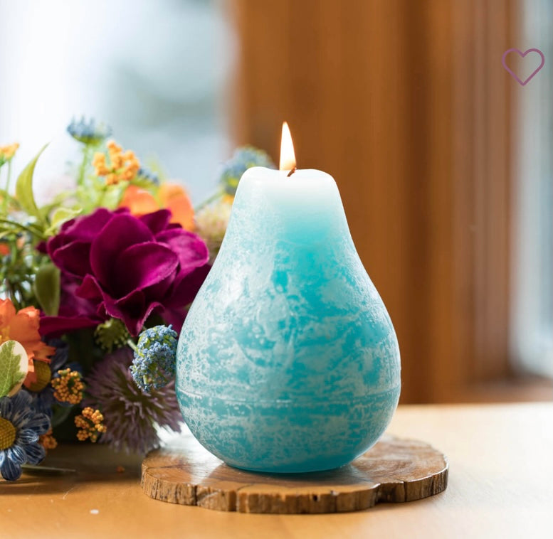 Timber Pear Candle Sea Glass product image features one pear shaped candle on a round wood tray.. Vance Kitira Collection.  Color is sea glass. This candle burns clean , smokeless , environmentally-friendly.  40 hours long burn time. Measures 3"L X 4.5"H.  Round wood tray not included.