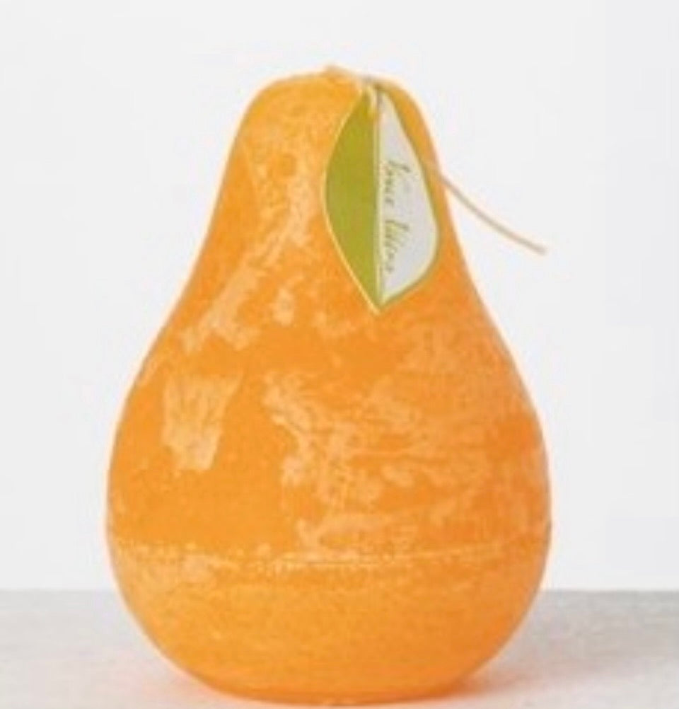 Timber Pear Candle Pumpkin product image features one pear shaped candle. Vance Kitira Collection. Pumpkin color. This candle  burns clean , smokeless , environmentally-friendly and boast long burn time. Measures 3"L X 4.5"H. Wood tray not included.  Hammered metal trays and gold rimmed rectangular trays available for purchase in store.