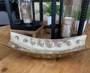 Decorative Nickel-Plated Bowls product image features a large decorative bowl.  Nickel plated.   Hammered and textured finish.  Measures 19.5"L X 8"W.  Recommended use:  display empty,  display with smaller decorative nickel-plated bowl, add an orchid arrangement, add about three green moss balls or three decorative balls.