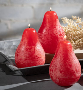 Timber Pear Candle Cranberry product image features a set of three pear shaped candle grouped together.  Vance Kitira Collection. Cranberry color. This candle burns clean , smokeless , environmentally-friendly and boast long burn time. Measures 3"L X 4.5"H. Wood tray not included. Slate tray candleholders and gold rimmed rectangular trays available for purchase in store.