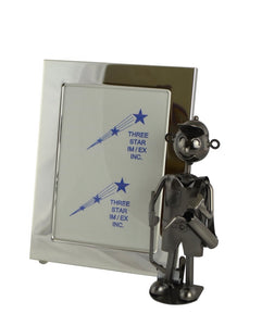 Golfer Picture Frame product image features a  1-inch, rectangular shaped, 5x7 picture frame with a glass protector.  Attached golfer holding a putter and golf bag.  Made of 100% recycled metal .  Color is silver.  Ready to ship.