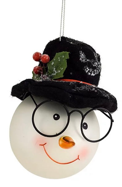 Snowman Head Glass Ornament product image features  a Christmas ornament.  Made of glass. Him. Wearing black rimmed spectacles and a felt top hat.   Bright eyed, orange nose and smiling lips.  Measures 6"H.  Ready to ship.