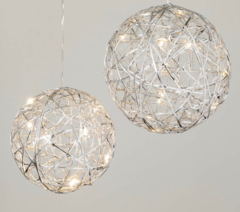 Lighted Ball Ornament Set -Silver features seasonal ball shaped lights. Gold. Round shape. Made of metal. Warm, white LED lights. Battery pack with on/off switch. Measure 6"x6"x6" and 7"x7"x7". Indoor use or outdoors in covered area.