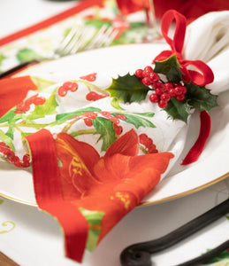 Poinsettia Table Napkins-Set Of Four product image features one napkin with ribbon tie on a plate.  Napkin is 20"L X 20"W.