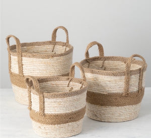 Decorative Baskets product image features  1 set of 3 baskets in different sizes.  Woven maize peel and jute.   All baskets have handles.  Colors are natural  and brown.  Sizes are 13"L X 12'W X 12.5" H, 11.5" L X 11.5"W X 11.5"H and 10"L X 10"W X 10"H.  These baskets are great for organizing your living room, kitchen, home office and nursery.   Sold as a set of 3.